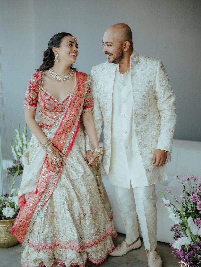 Prithvi Shaw & Akriti Agarwal’s Elegant Engagement Look in Ivory and Coral
